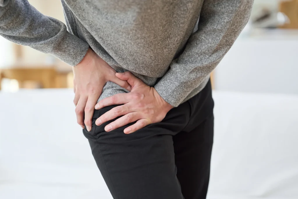 adult experiencing hip pain at home 2026 03 05 11 53 47 utc 3