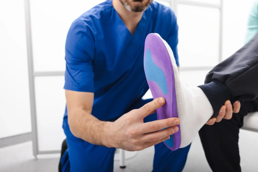 adult male applying insole in medical office 2026 03 25 10 38 32 utc 1 1