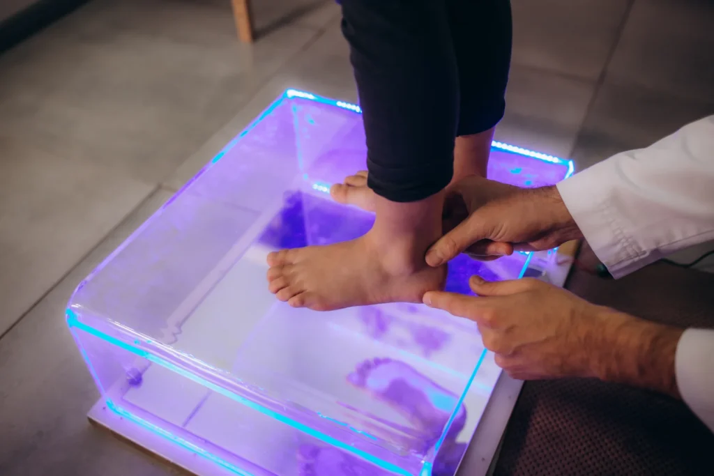 child stands on illuminated foot scanning platform 2026 03 24 04 45 29 utc