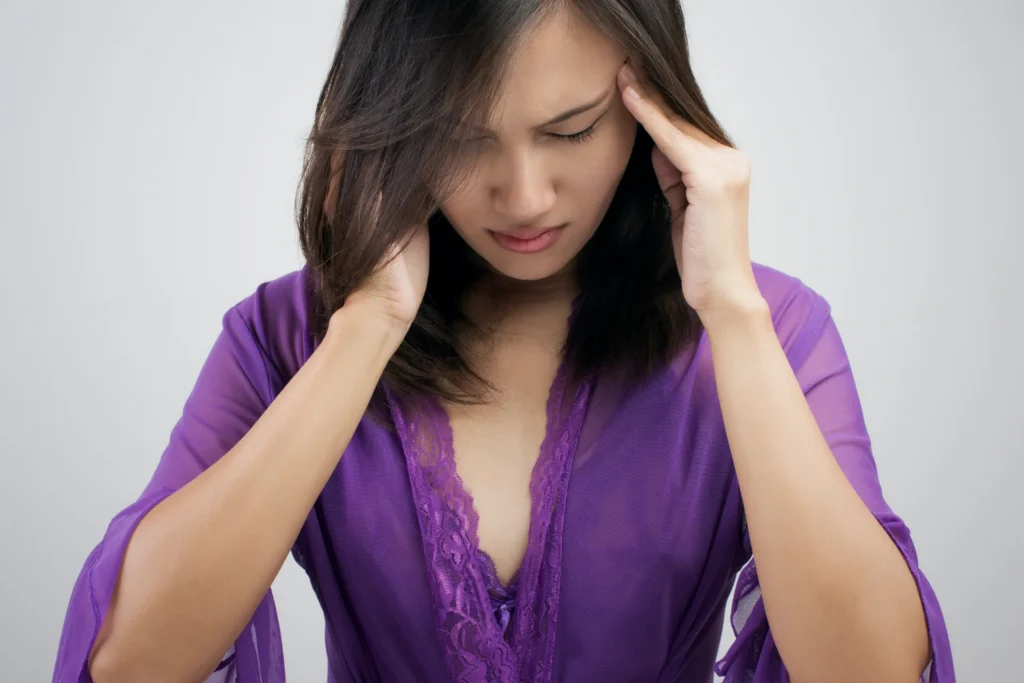 woman massaging head eyes closed in distress 2026 03 16 04 44 53 utc