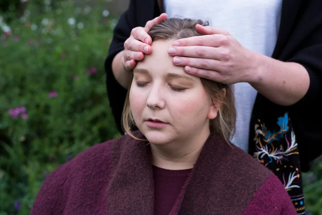 woman receives gentle massage outdoors in garden 2026 01 09 08 35 00 utc