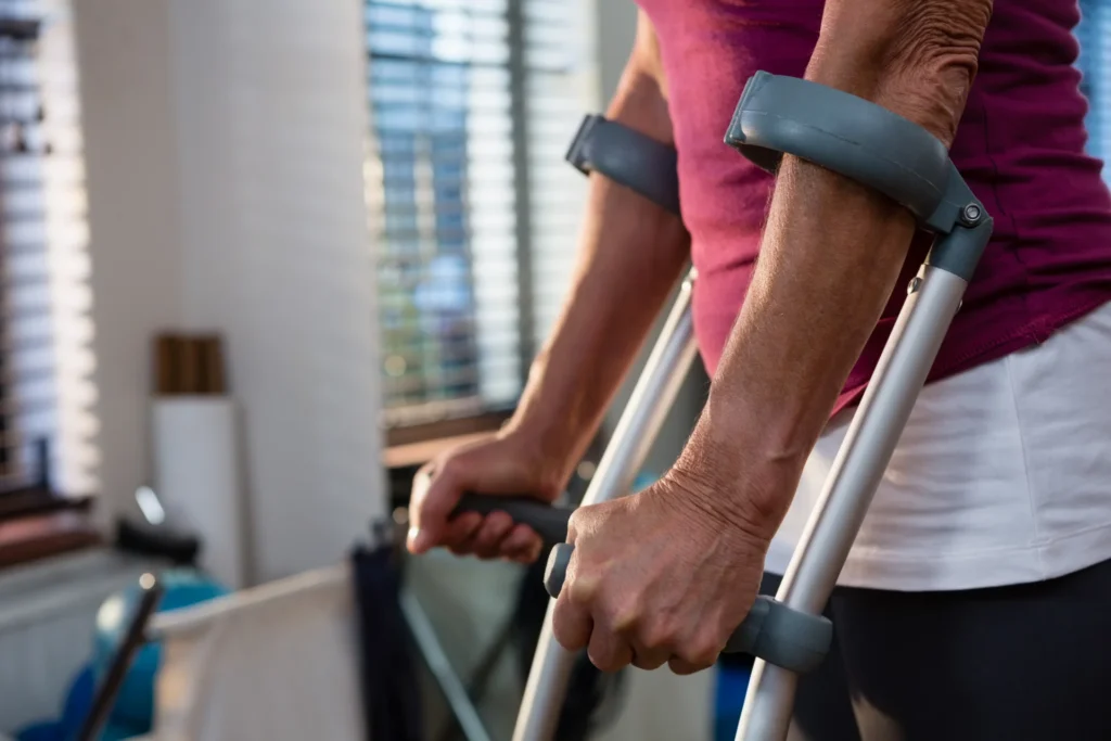 woman recovering using crutches in sunny home 2026 03 26 11 49 15 utc