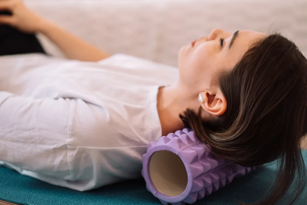 woman using foam roller at home for relaxation 2026 01 08 05 22 36 utc