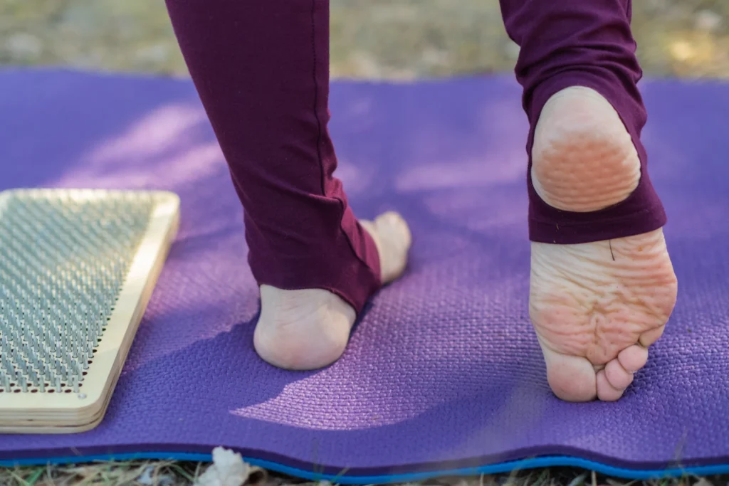 person s bare feet on a purple yoga mat 2026 03 18 13 45 40 utc