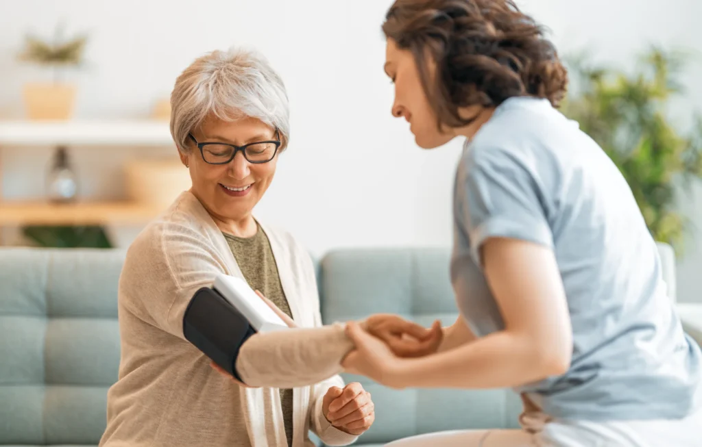 caregiver checking the blood pressure of senior wo 2026 03 11 01 02 27 utc