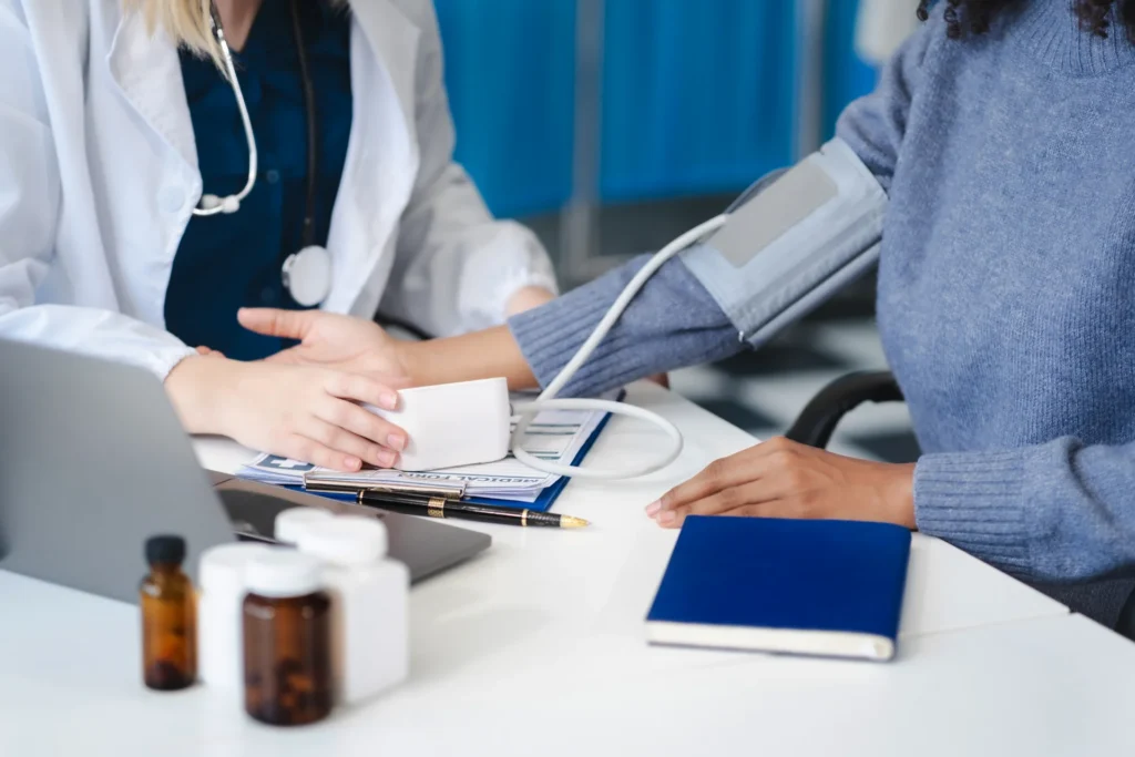 doctor measuring blood pressure in hospital exam r 2026 03 17 04 06 09 utc