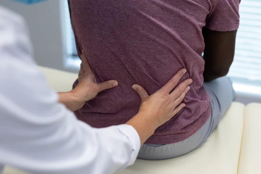 examination of lower back pain at doctor s office 2026 01 09 09 24 58 utc