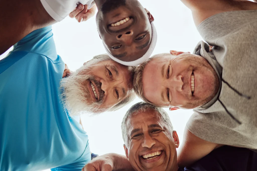 smiling men huddle together in good spirits 2026 09 24 14 11 24 utc