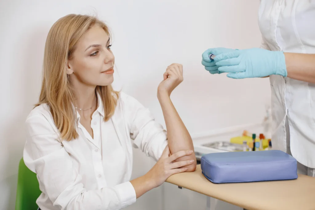woman getting a blood test at the hospital 2026 03 17 14 27 10 utc 1
